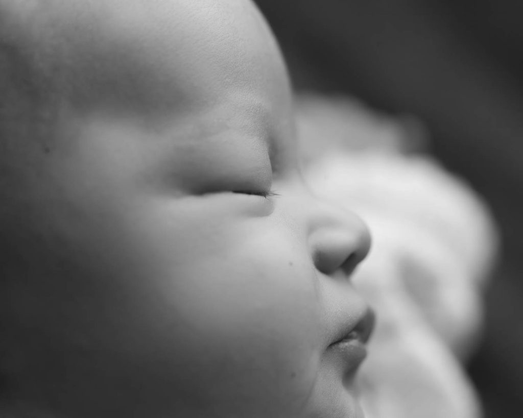 Black and white Newborn Photography close up of the sleeping face